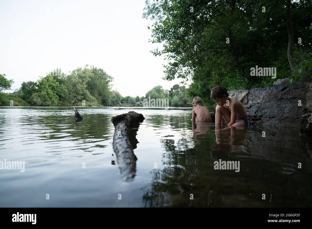 Two boys play in water hi-res stock photography and images - Alamy