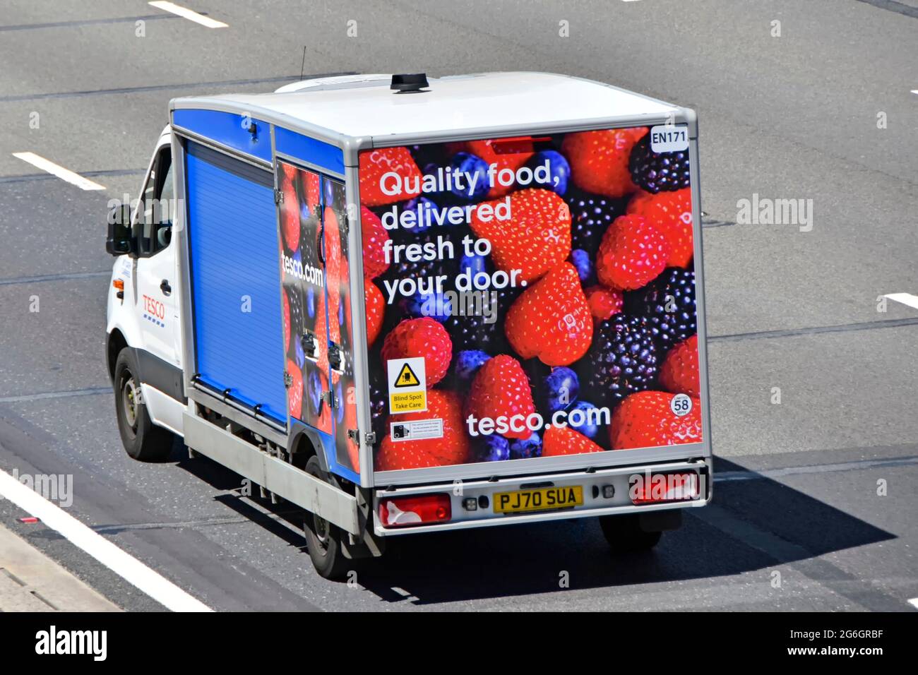 Aerial top side & back graphic on Tesco supermarket van a food supply chain retail business transport delivery online grocery shopping on UK motorway Stock Photo
