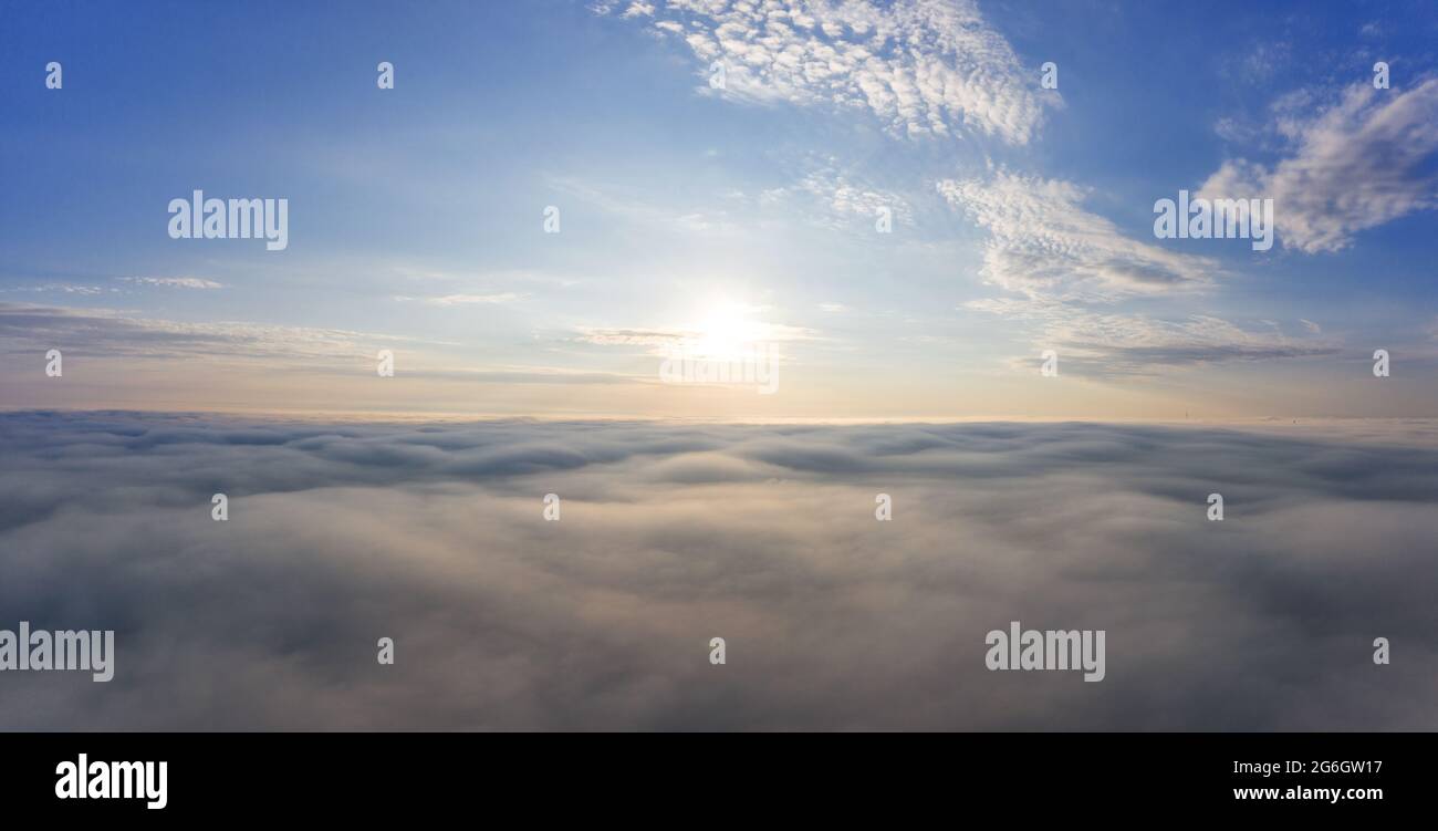 Sunrise over the clouds view from the drone Stock Photo