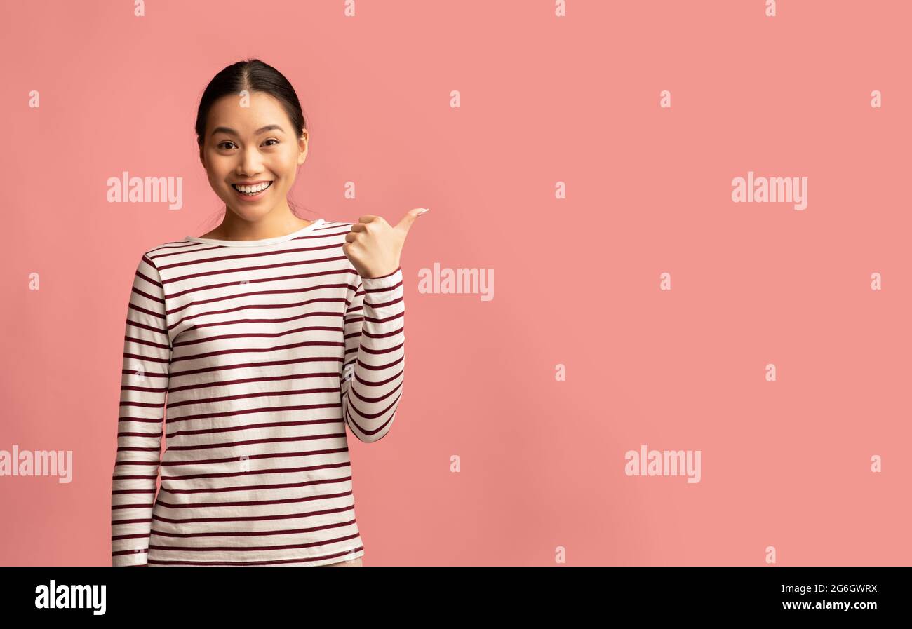 Cheerful young woman showing thumb hi-res stock photography and images ...