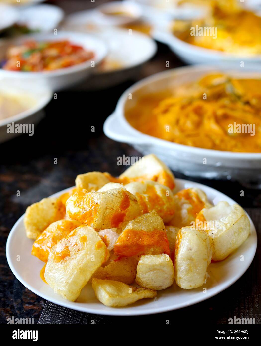 Rambak, jangek or kerupuk kulit is an Indonesian traditional crackers. It is made from the skin of cow, served with curry sauce - delicious and tasty Stock Photo