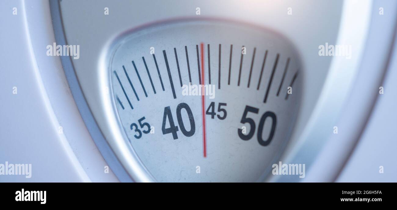 body weight scales for measure weight loss.Weighing scale to healthy slimming concept Stock