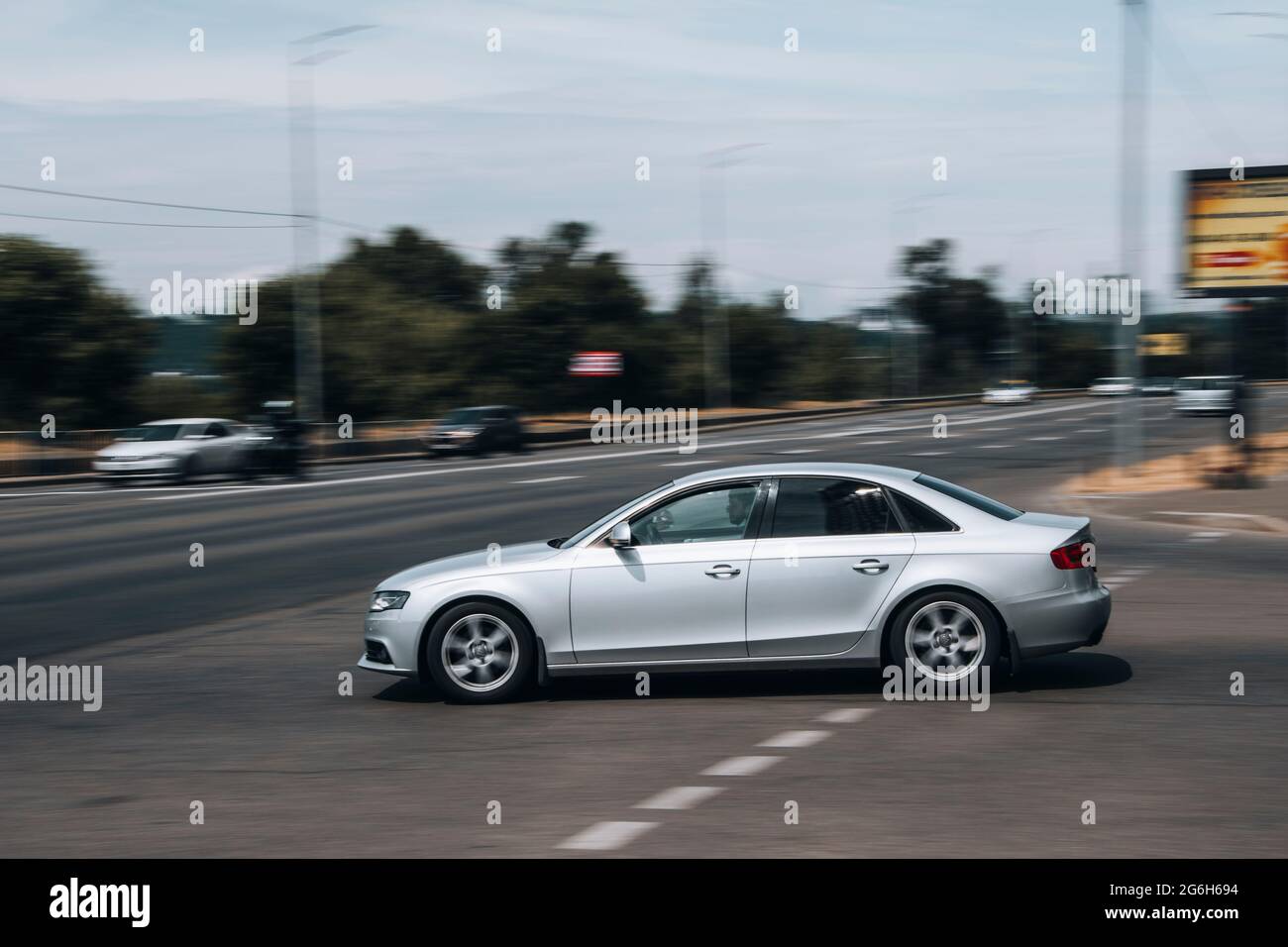 Ukraine, Kyiv - 27 June 2021: Silver Audi A4 car moving on the street. Editorial Stock Photo
