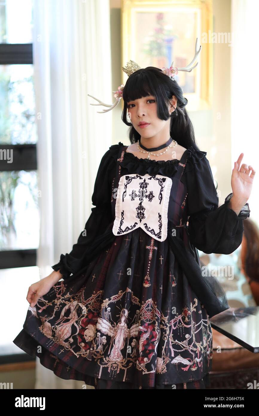 Portrait of asian girl in lolita fashion dress in vintage garden background  Stock Photo - Alamy
