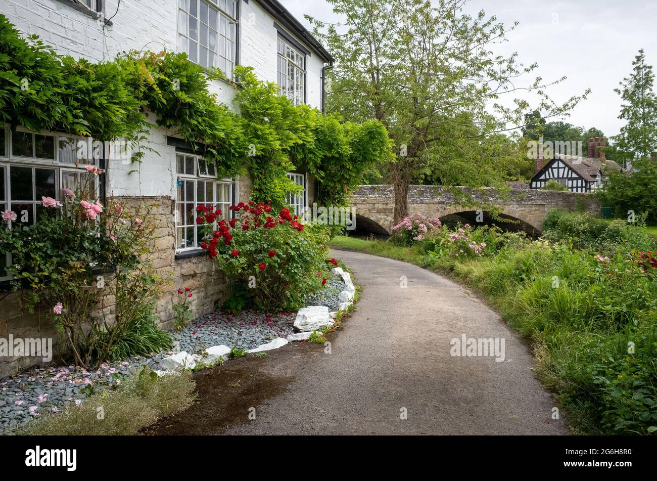 old stone houses in the village, with a river near the cottages Stock Photo