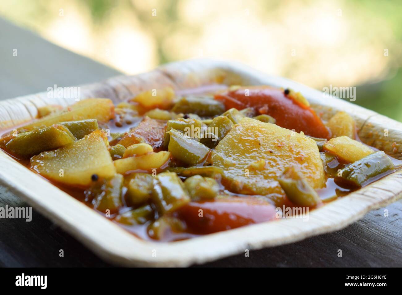 Indian food side dish Aloo beans ki sabji made from potato, tomato and