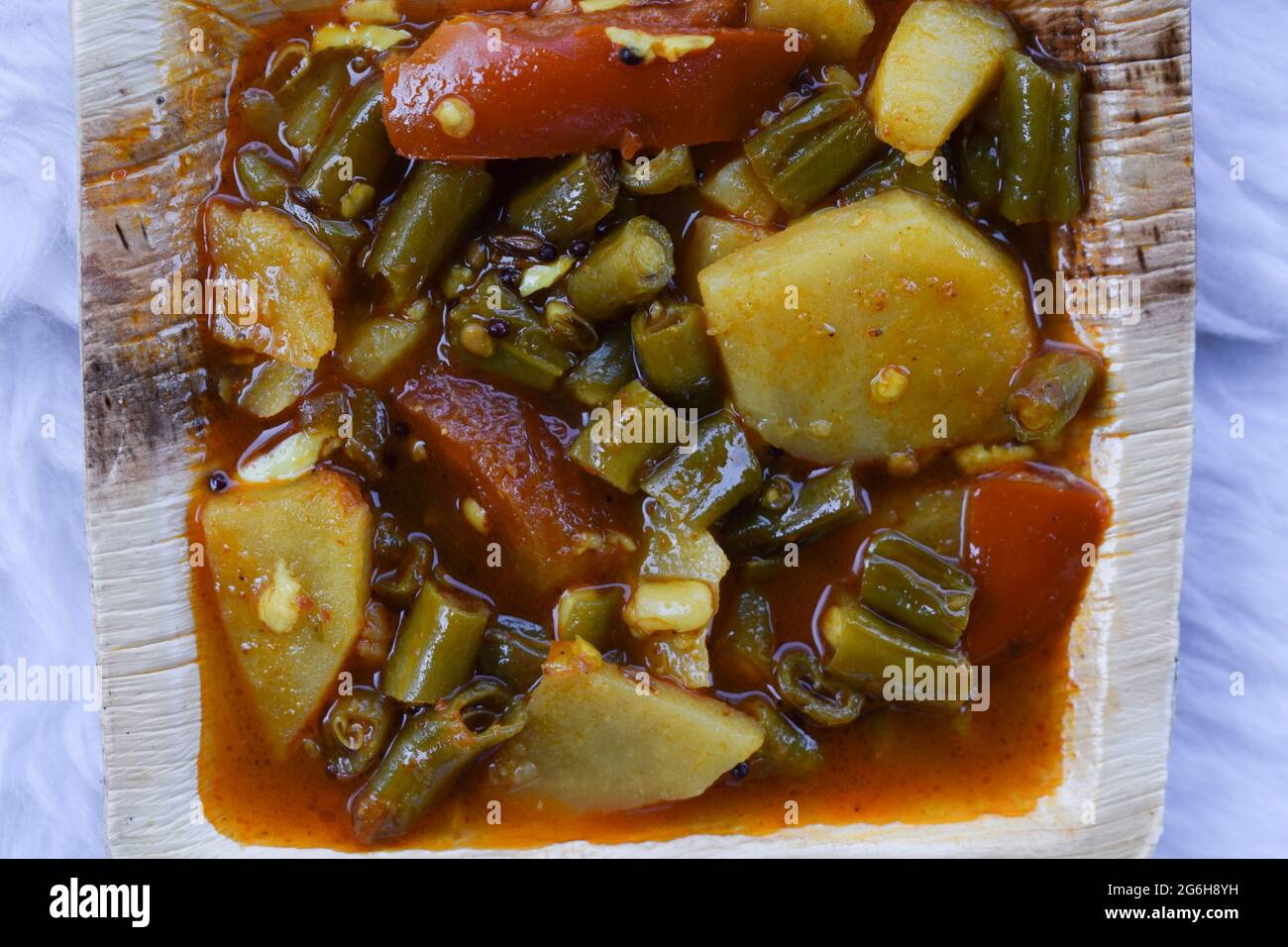 Indian food side dish Aloo beans ki sabji made from potato, tomato and