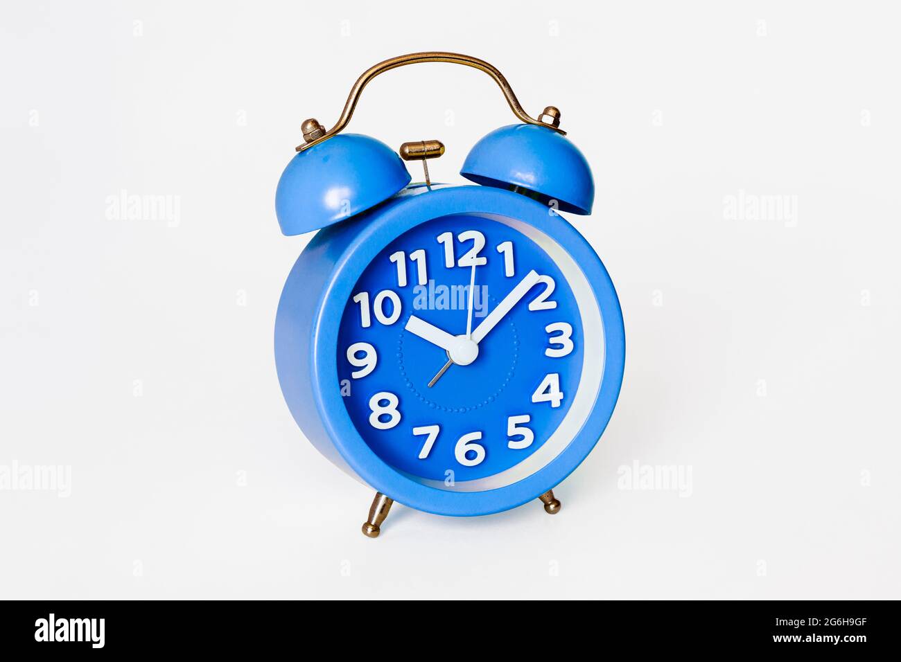 A traditionalstyle alarm clock with two bells isolated on a white
