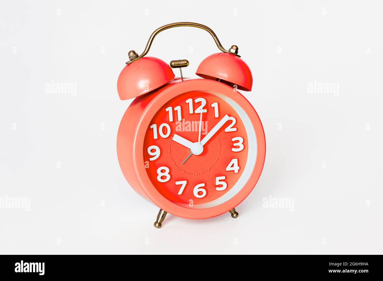 A traditionalstyle alarm clock with two bells isolated on a white