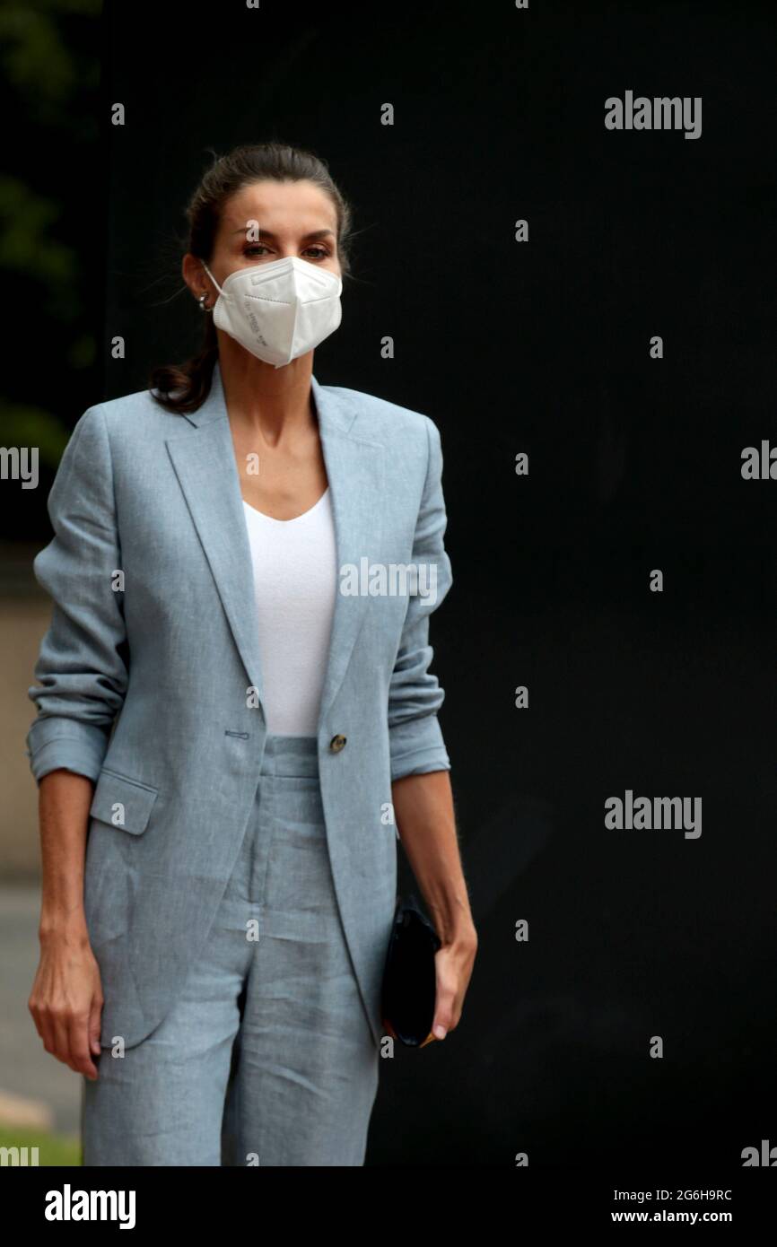 Madrid, Spain; 06.07.2021.- For an event organized by Abertis and Unicef, Queen Letizia debuts working look a blue linen suit by Adolfo Domínguez perfect for high temperatures, consisting of capri pants and a long blazer with a single button, which was unbuttoned and with the sleeves rolled up She has combined it with a simple white top, a basic with a V-neckline, shoes that combine skin and snakeskin in navy blue and a matching bag. As for jewelery, the hoop earrings in white gold, diamonds and aquamarines from Bulgari. Karen Hallam's ring. The working meeting with members of the management t Stock Photo