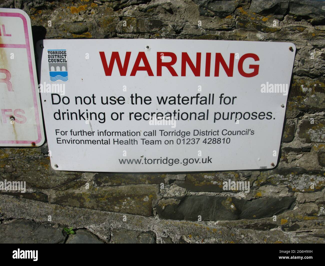 Warning do not drink water from the waterfall sign. Buck's Mills. South west coast path. North Devon. West country. England. UK Stock Photo