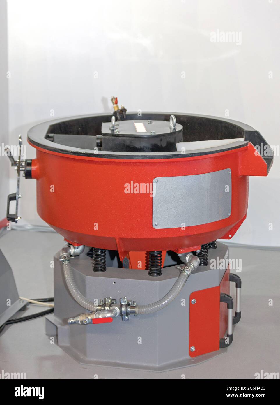 Vibratory Polishing Tumbler Machine Drum in Factory Stock Photo