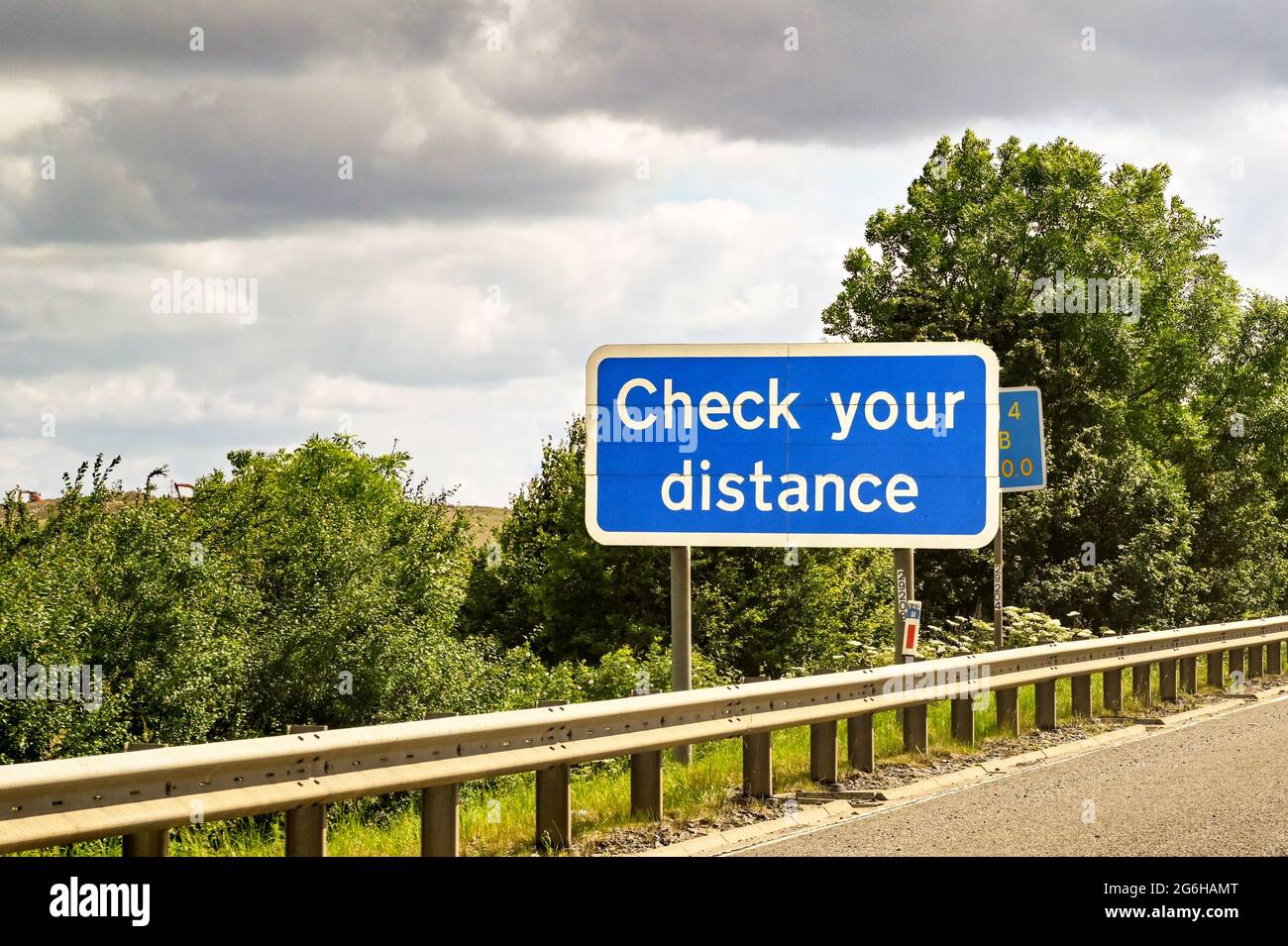 Safety sign on a motorway advising drivers to check the distance between vehicles Stock Photo