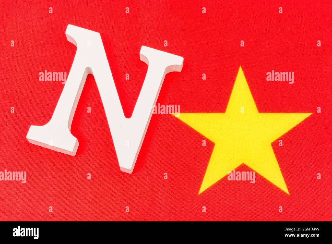 Fabric China flag + wood 'N' & yellow star to represent 'No'. For Australia & India China boycott, China human rights, Philippines' China resistance. Stock Photo