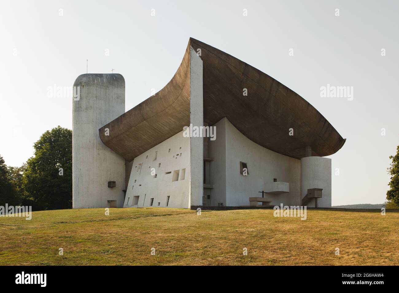 Chapel of Notre Dame du Haut designed by Swiss modernist architect Le Corbusier (1955) in Ronchamp, France. South and east facades of the chapel. Stock Photo