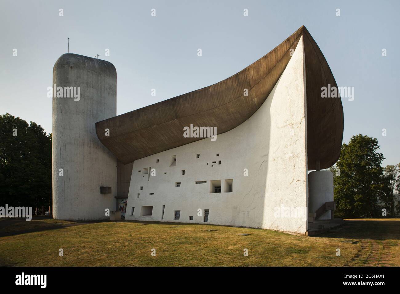 Chapel of Notre Dame du Haut designed by Swiss modernist architect Le Corbusier (1955) in Ronchamp, France. South facade of the chapel. Stock Photo