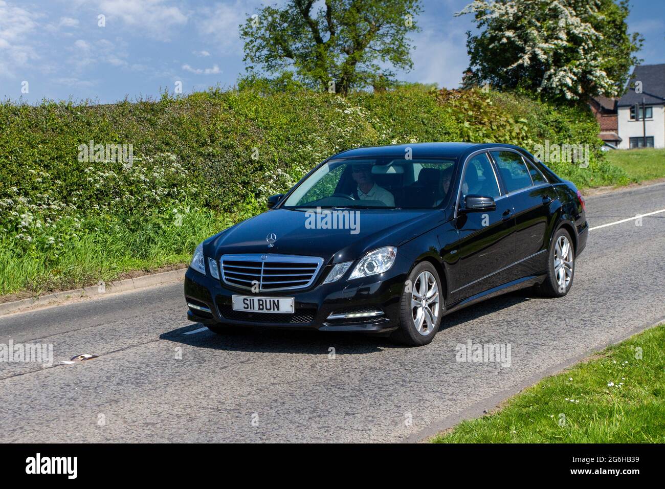 2011 black Mercedes Benz E 7 speed sequential diesel  automatic, en-route to Capesthorne Hall classic May car show, Cheshire, UK Stock Photo