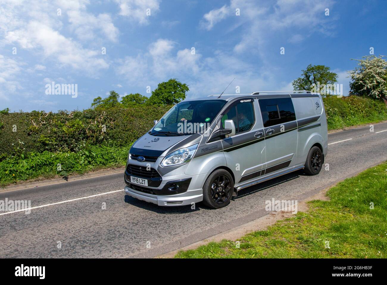 2015 grey Ford Transit M-Sport RS Edition window van 6 speed manual 2198cc diesel van en-route to Capesthorne Hall classic May car show, Cheshire, UK Stock Photo