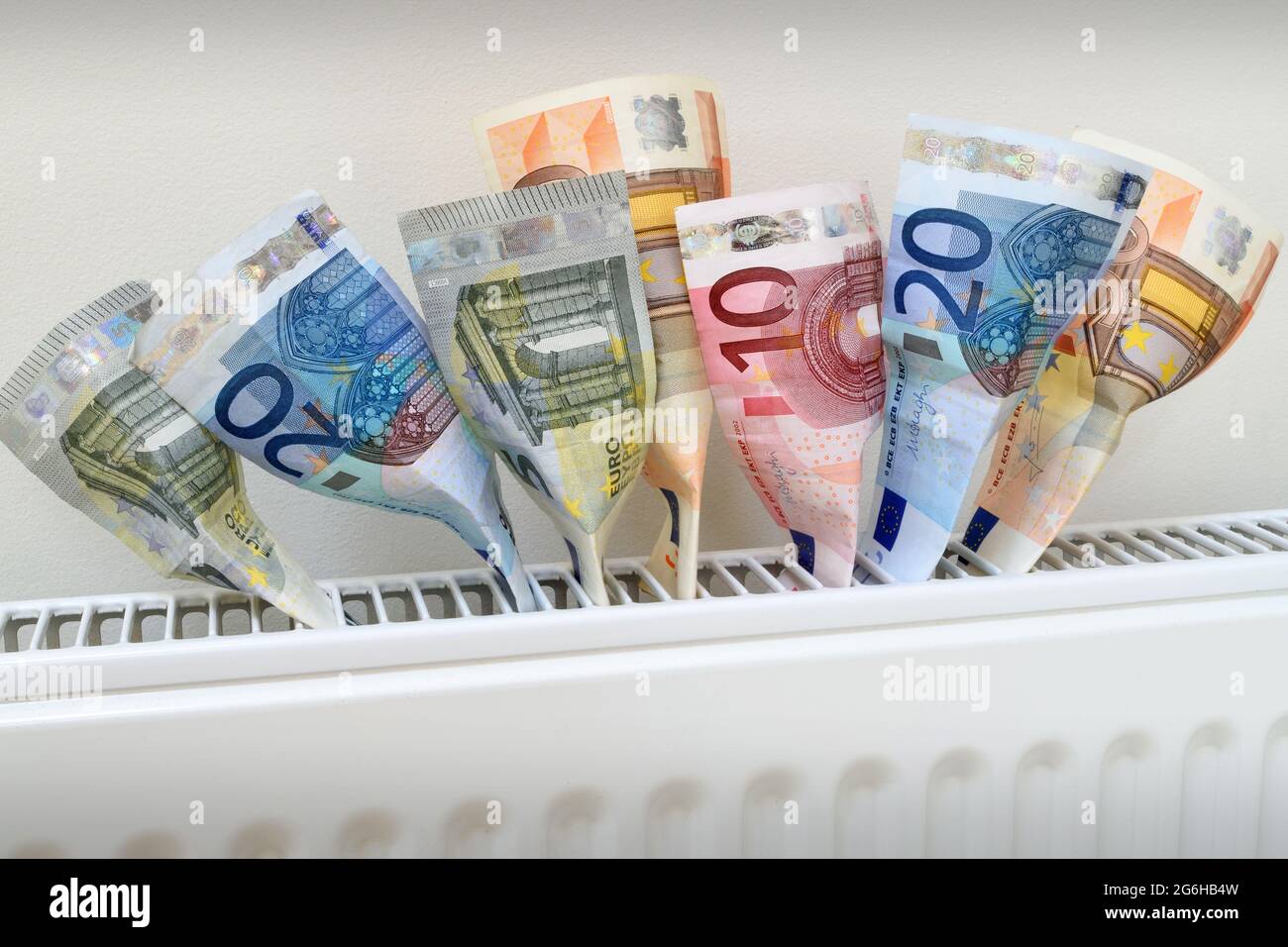 Euro banknotes coming out of a radiator, symbolizing heat as money ...