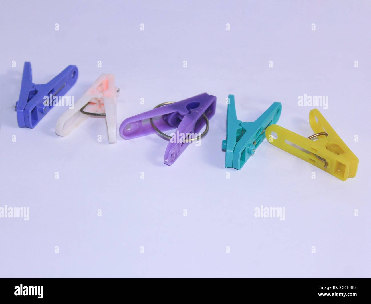 colorful of clothes peg white background Stock Photo - Alamy