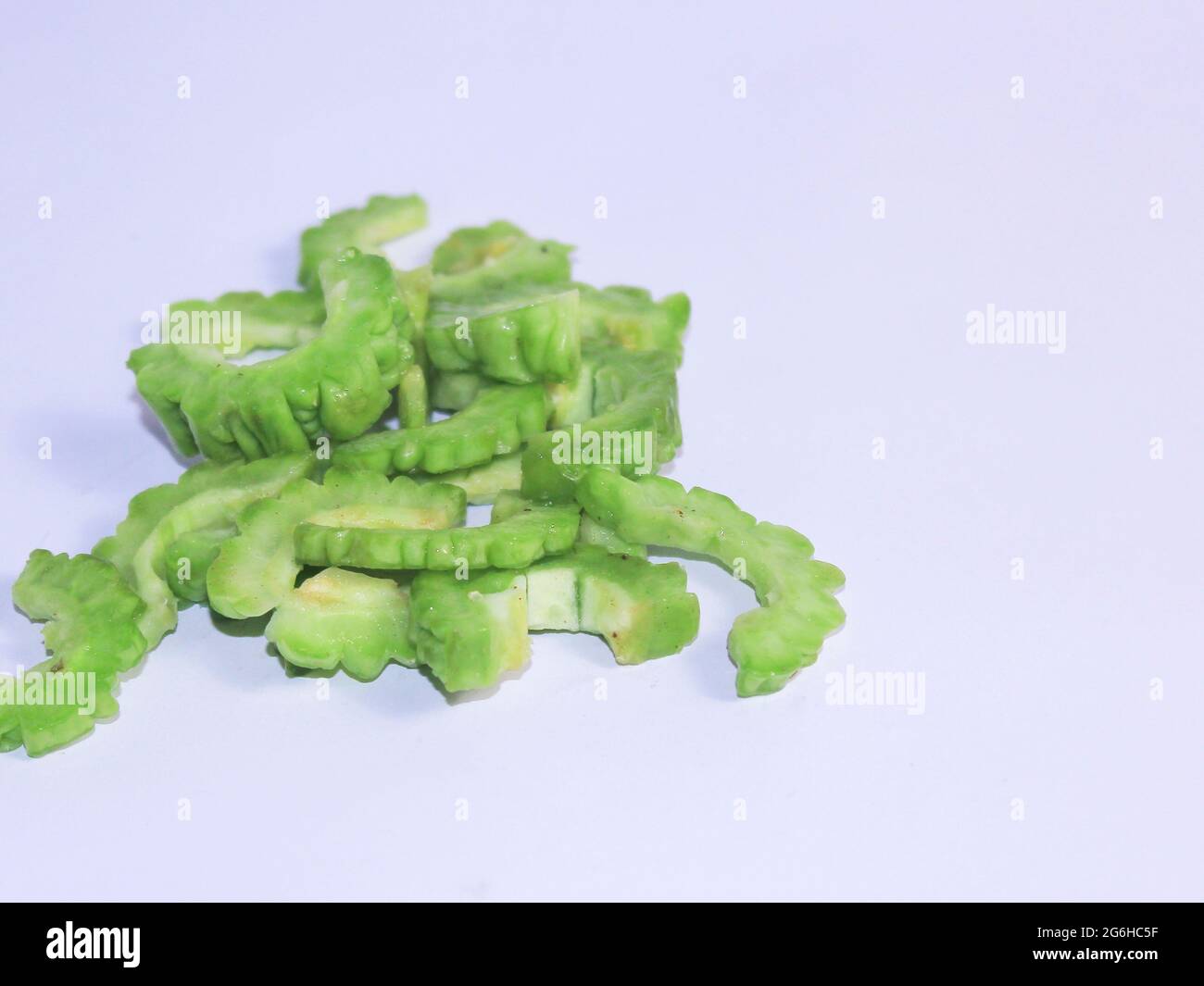 Fresh green bitter gourd on a white background. One of the vegetables