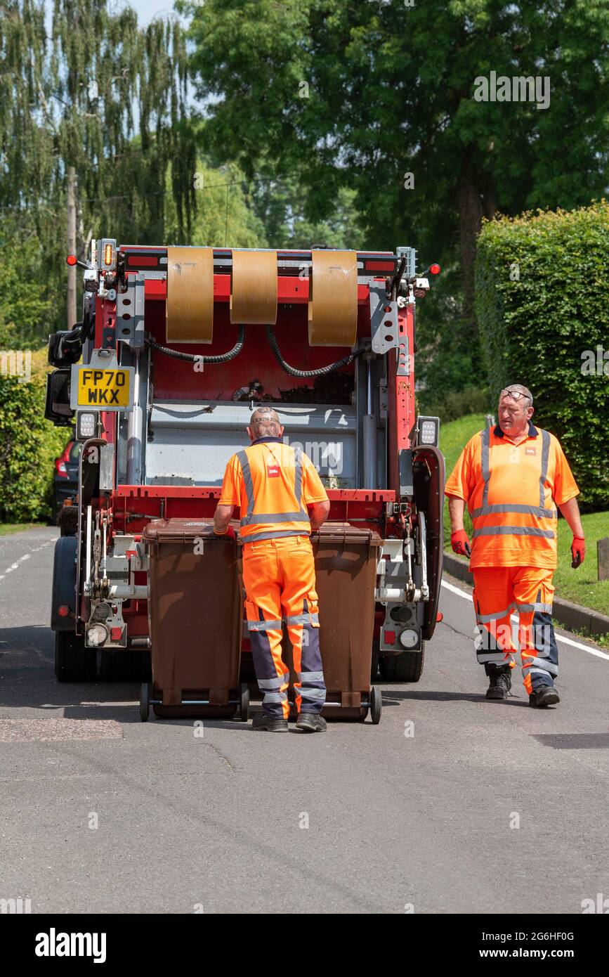 Hampshire, England, UK. 2021. Council operatives collect garden waste