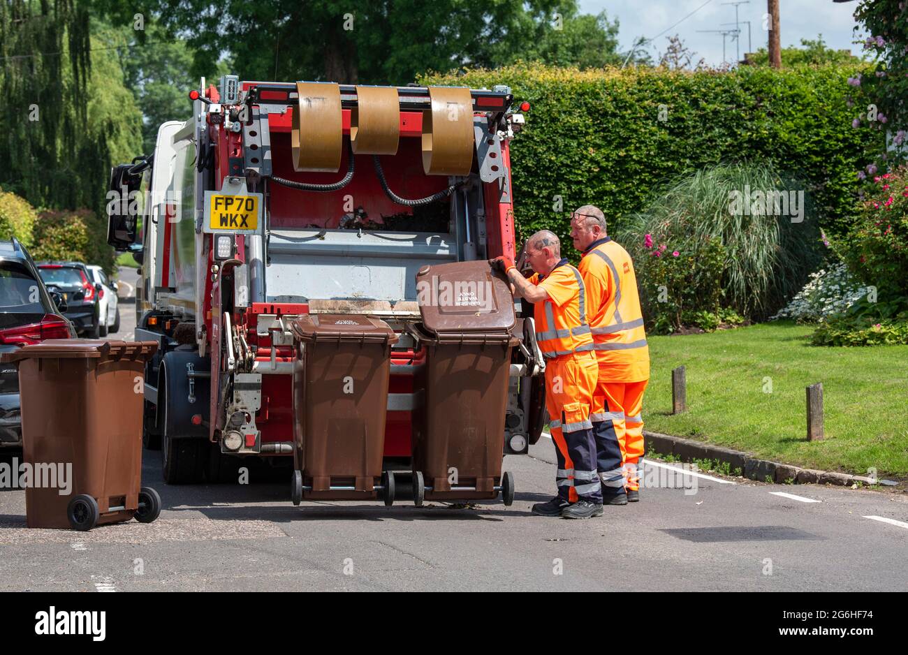 Hampshire, England, UK. 2021. Council operatives collect garden waste
