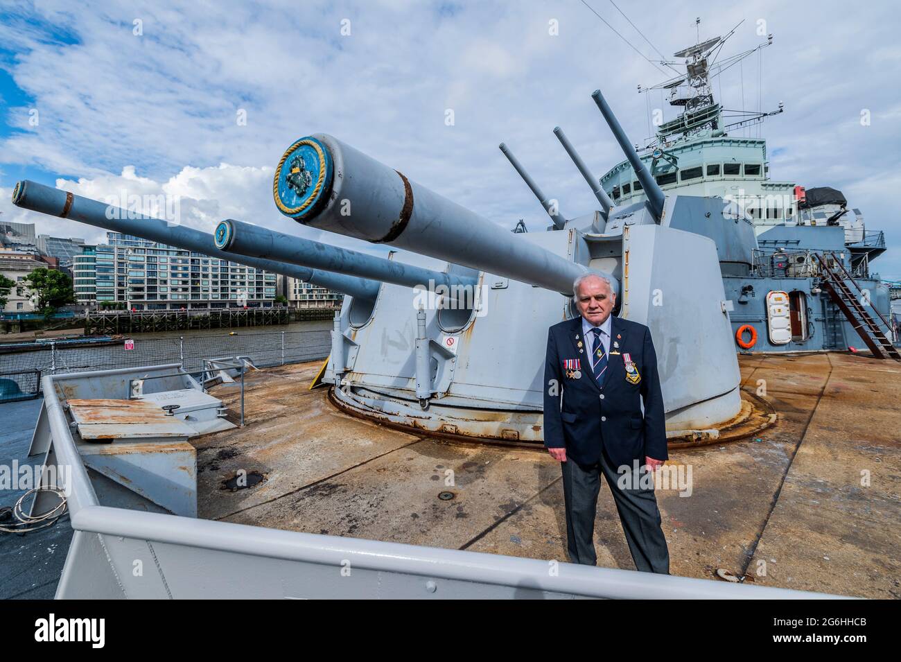 London, UK. 6th July, 2021. In front of the main guns - Bernie Bristoll a  radio operator and Chief petty Officer in the Royal Navy, served on the  ship for 2 years.