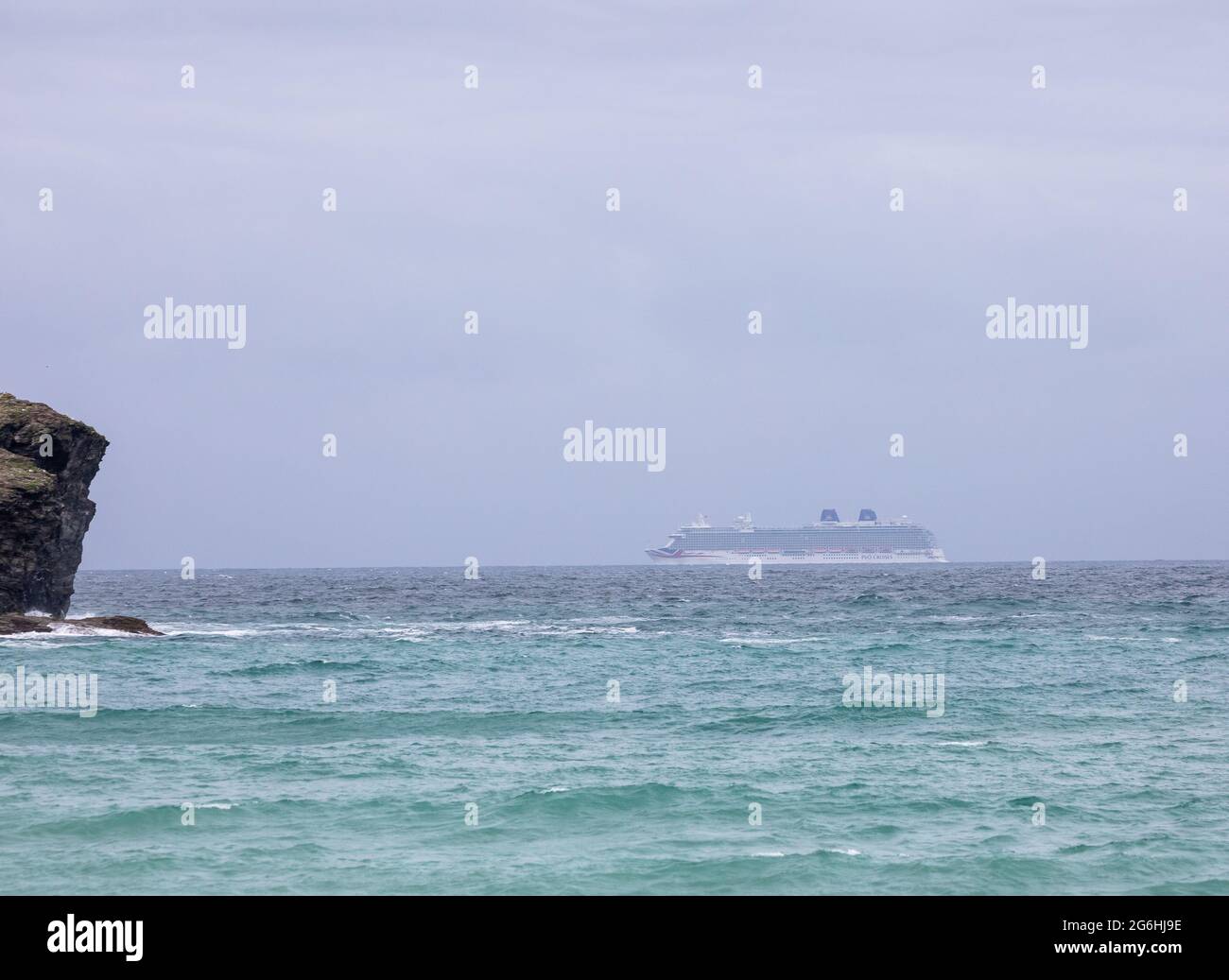 Portreath, Cornwall,6th July 2021, People watched from the beach as Cruise ship, Brittania, passes Portreath in Cornwall. Due to covid 19 regulations the ship is only cruising the UK with no port calls. Credit: Keith Larby/Alamy Live News Stock Photo