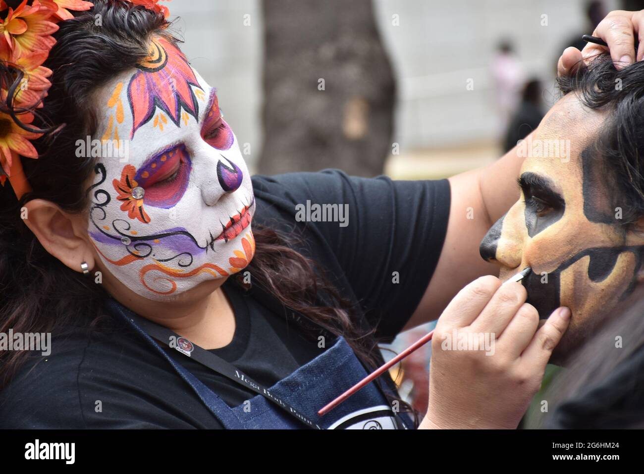 People dress as Catrina, an iconic image for Day of the Dead in Mexico, and participate in a parade the week before Day of the Dead. Stock Photo