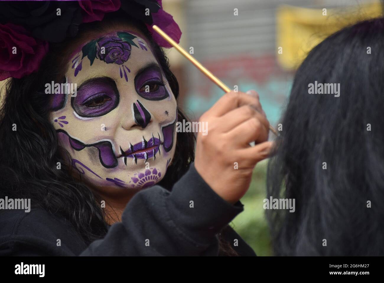People dress as Catrina, an iconic image for Day of the Dead in Mexico, and participate in a parade the week before Day of the Dead. Stock Photo
