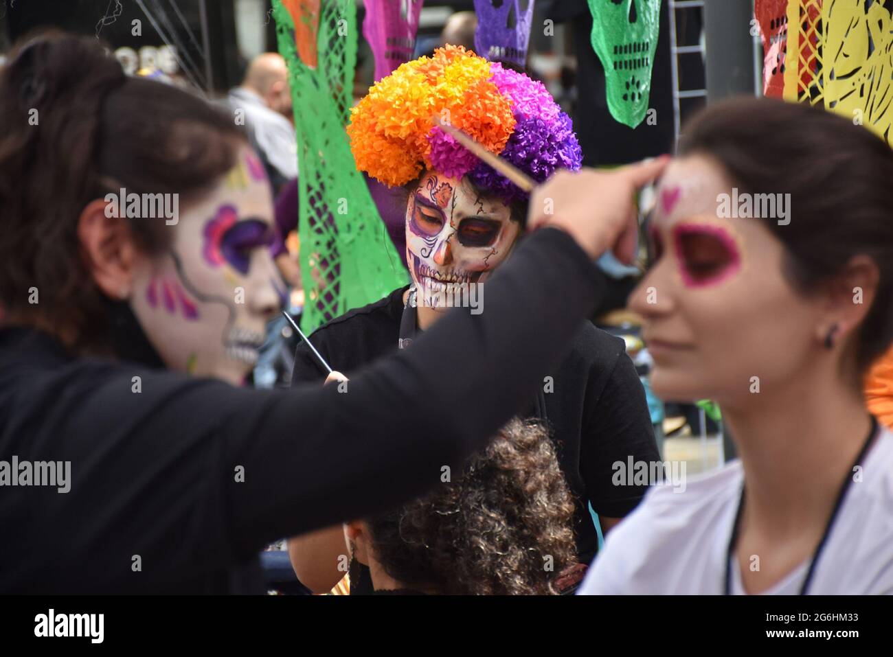 People dress as Catrina, an iconic image for Day of the Dead in Mexico, and participate in a parade the week before Day of the Dead. Stock Photo