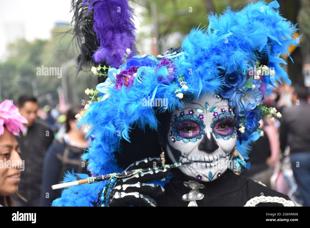 People dress as Catrina, an iconic image for Day of the Dead in Mexico, and participate in a parade the week before Day of the Dead. Stock Photo