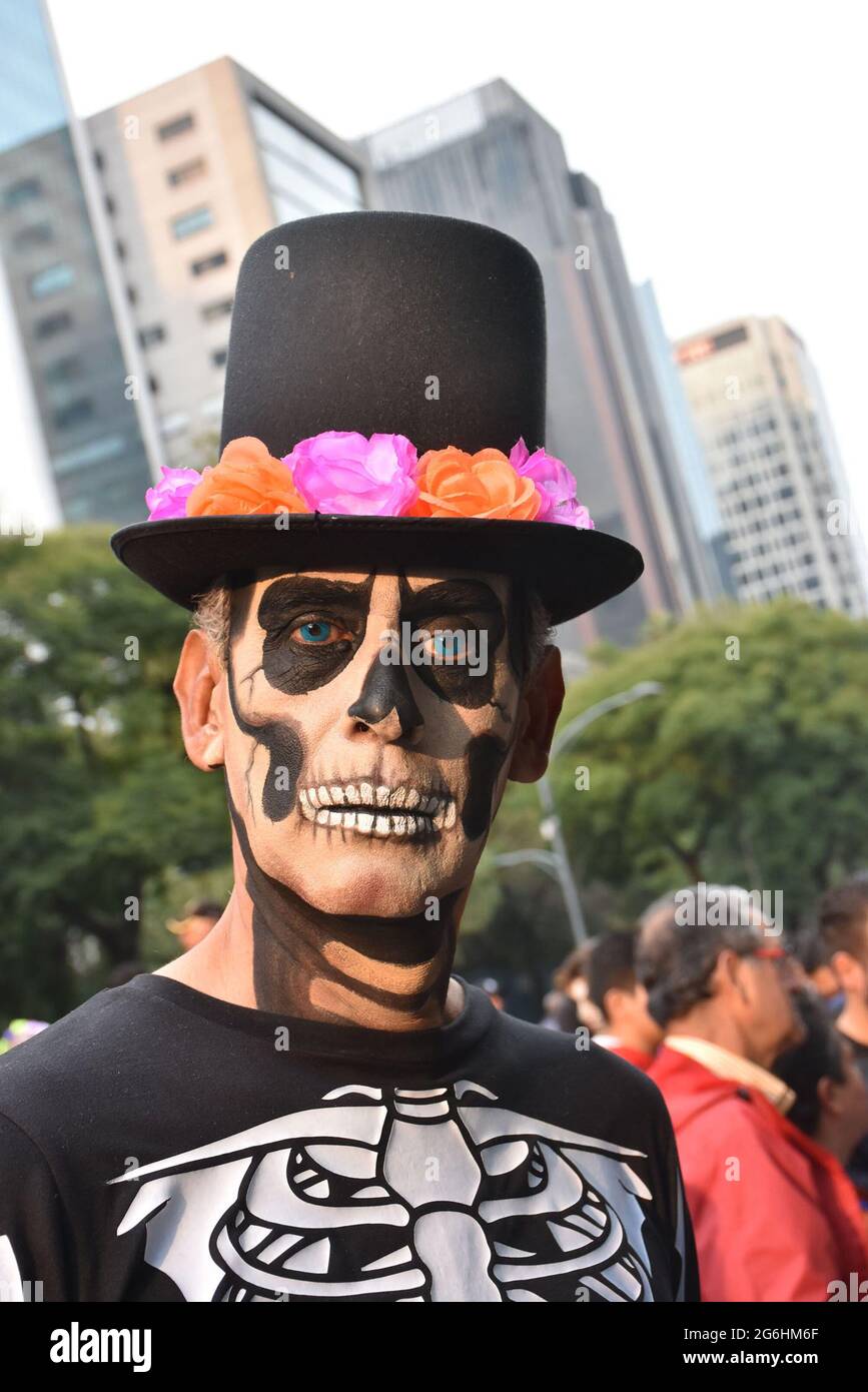 People dress as Catrina, an iconic image for Day of the Dead in Mexico, and participate in a parade the week before Day of the Dead. Stock Photo