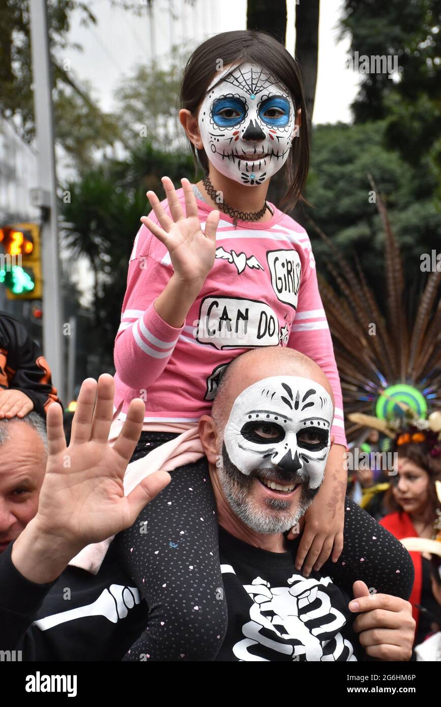 People dress as Catrina, an iconic image for Day of the Dead in Mexico, and participate in a parade the week before Day of the Dead. Stock Photo