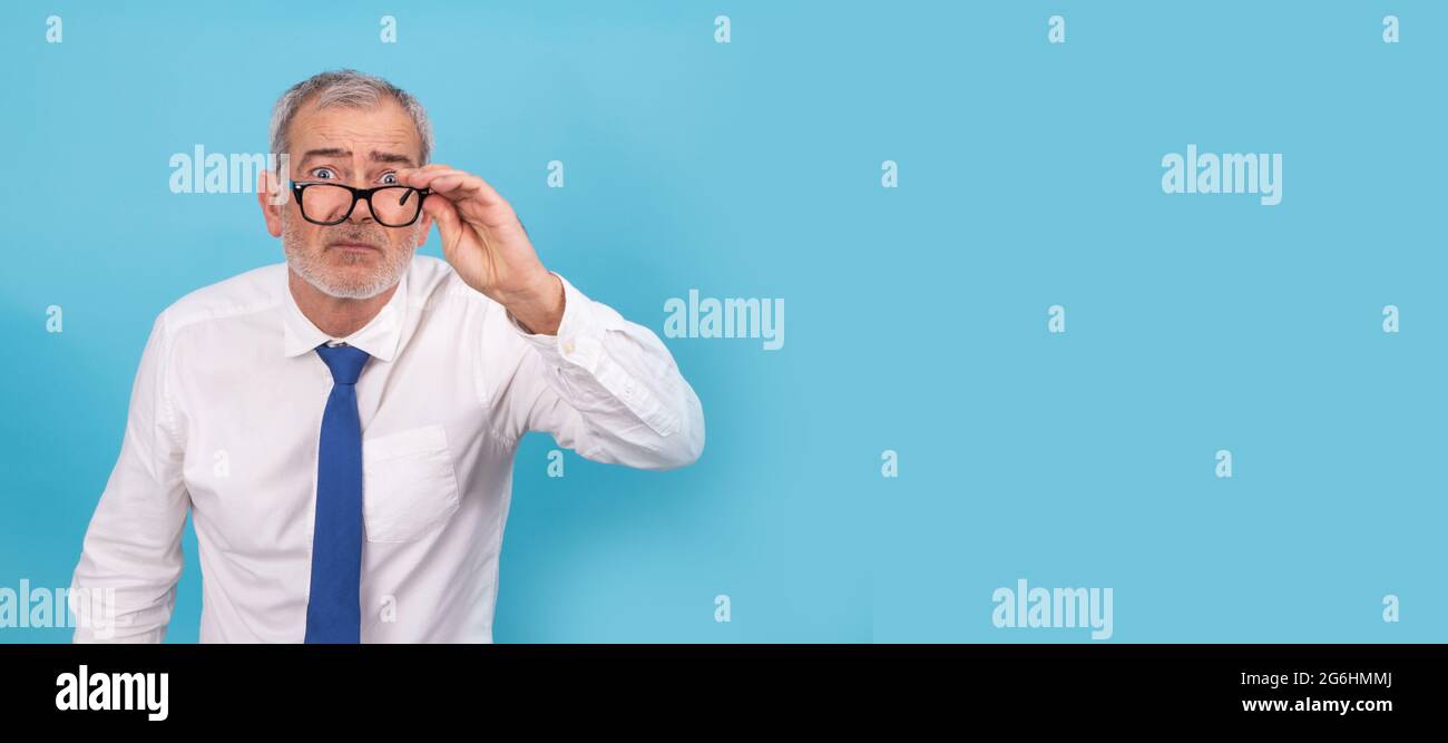 business man looking with glasses with presbyopia isolated Stock Photo