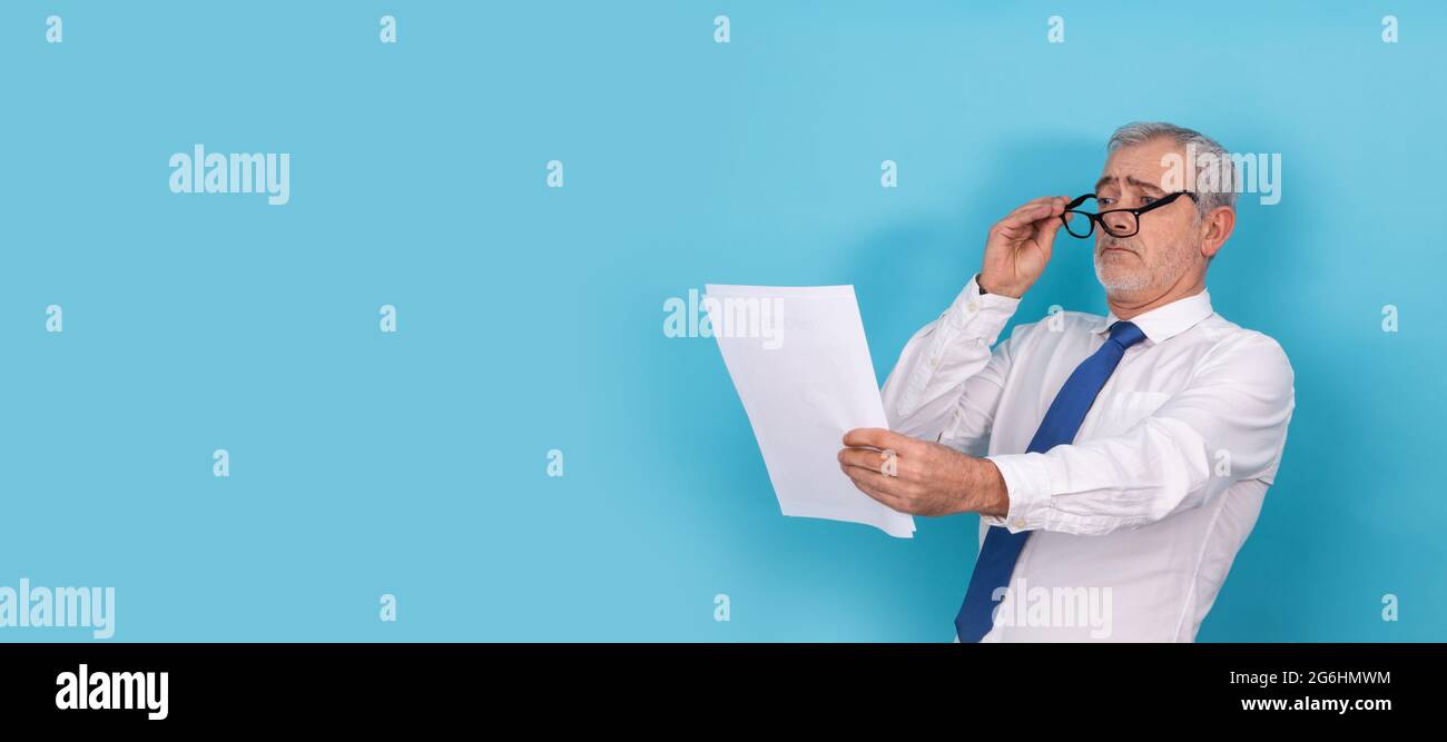 business man looking with glasses with presbyopia isolated Stock Photo