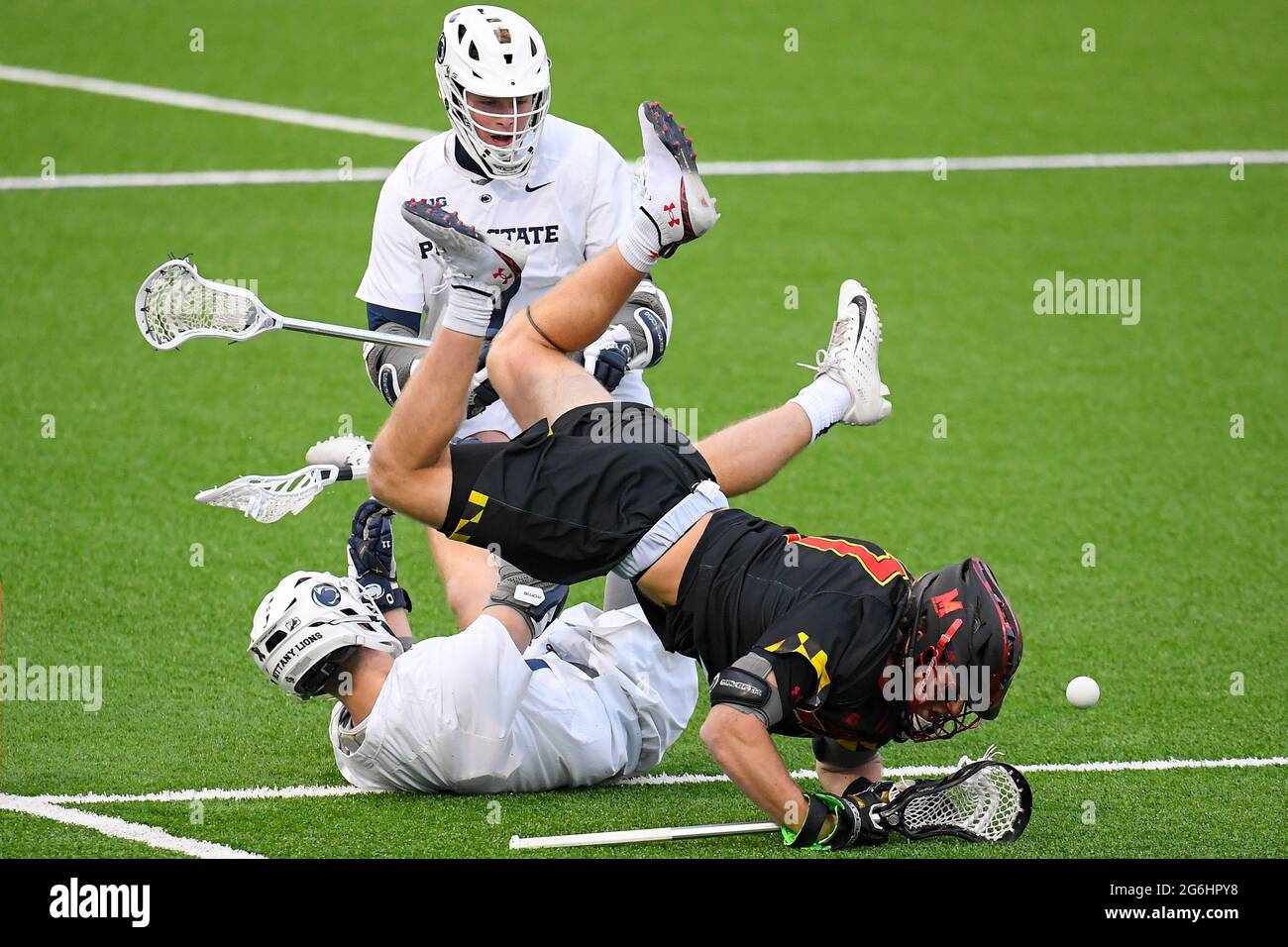February 26, 2021: Maryland Terrapins midfielder Jake Higgins (57) trips over Penn State Nittany Lions attackman Dylan Foulds (11) during the first half of an NCAA mens lacrosse game on Friday, Feb., 26, 2021 at Panzer Stadium in State College, Pennsylvania. Maryland won 13-7. Rich Barnes/CSM Stock Photo