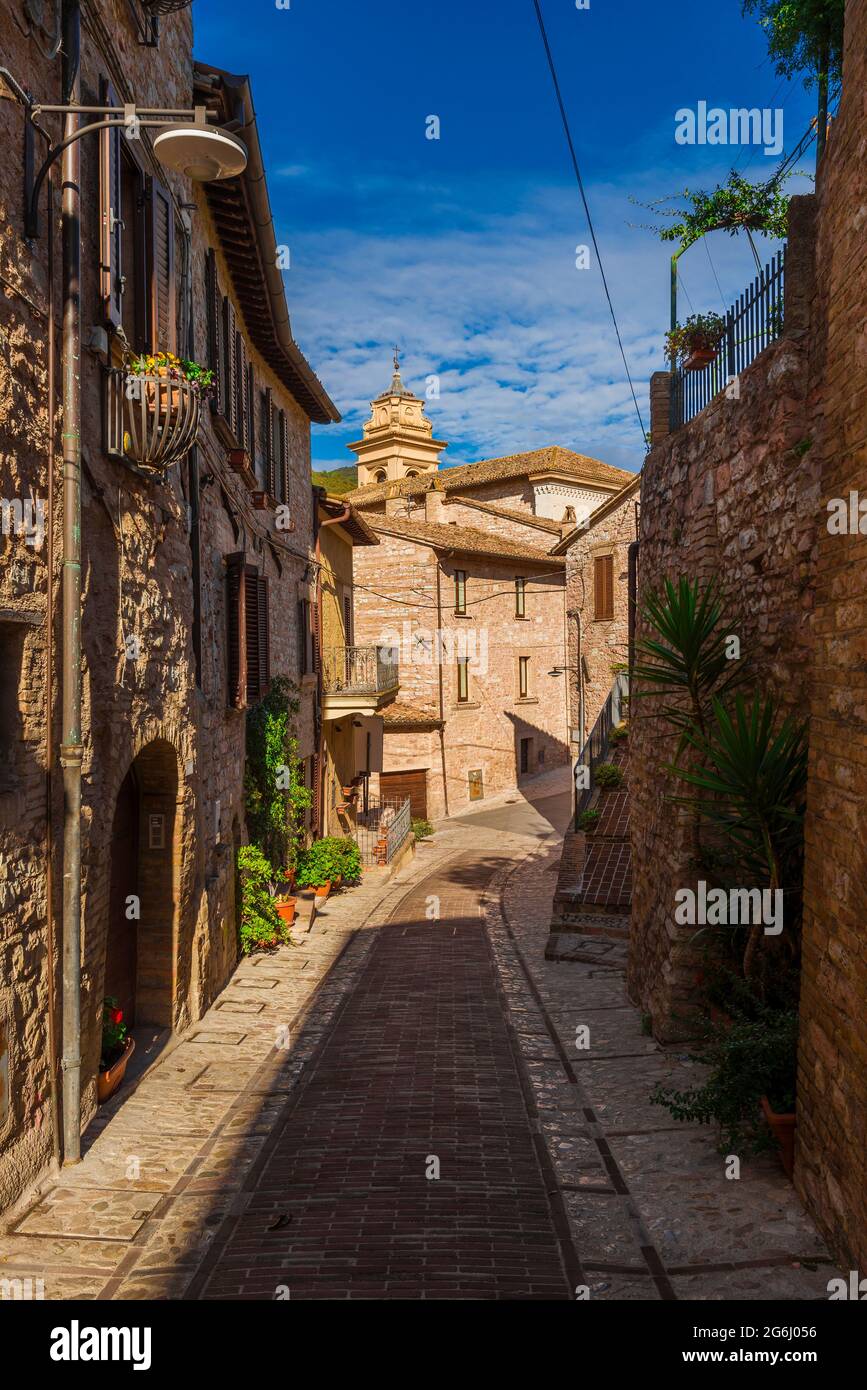 Spello charming historic center lane with an old church bell tower Stock Photo
