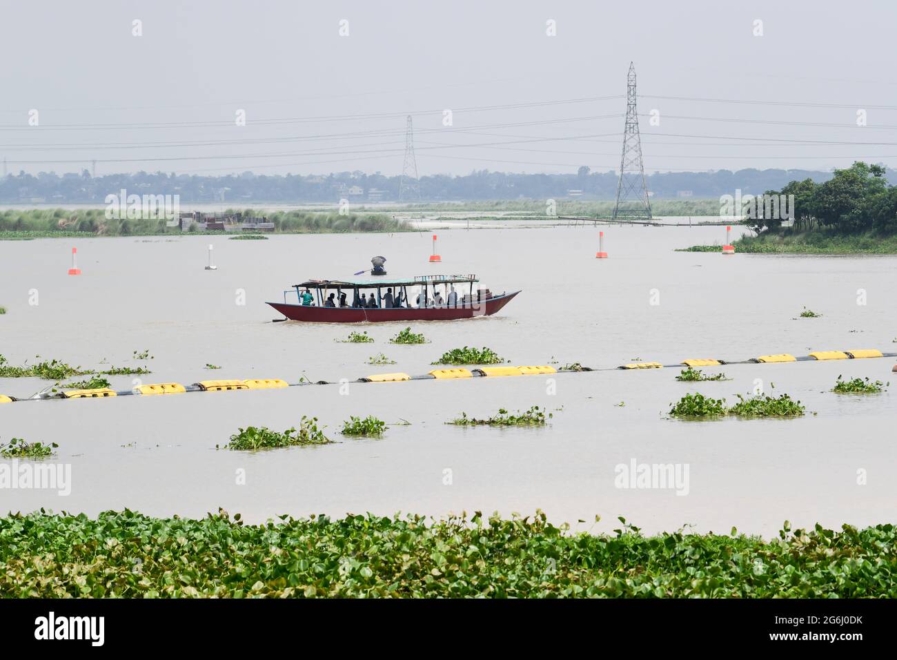 People are seen crossing the Turag River by boat during a countrywide lockdown in Dhaka. (Photo by Piyas Biswas / SOPA Images/Sipa USA) Stock Photo