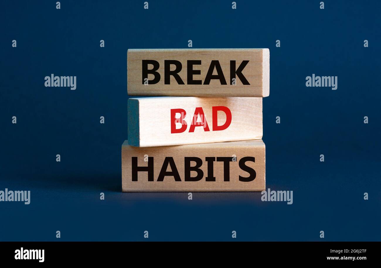 Break bad habits symbol. Wooden blocks with words 'break bad habits ...