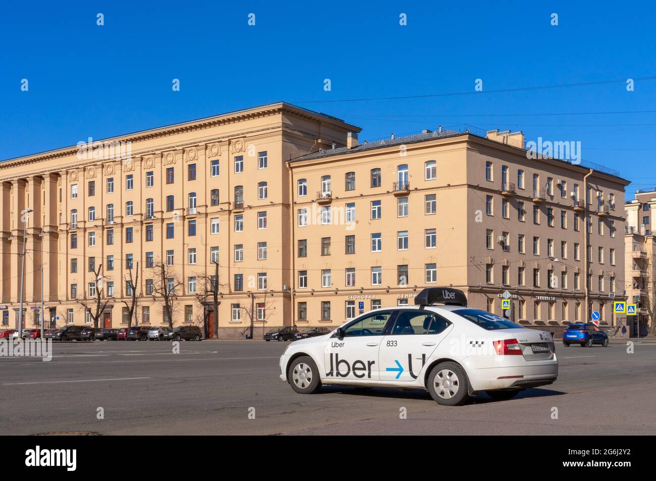 Empty Uber taxi car on square outside stalinist ampire historical building, St Petersburg, Russia Stock Photo