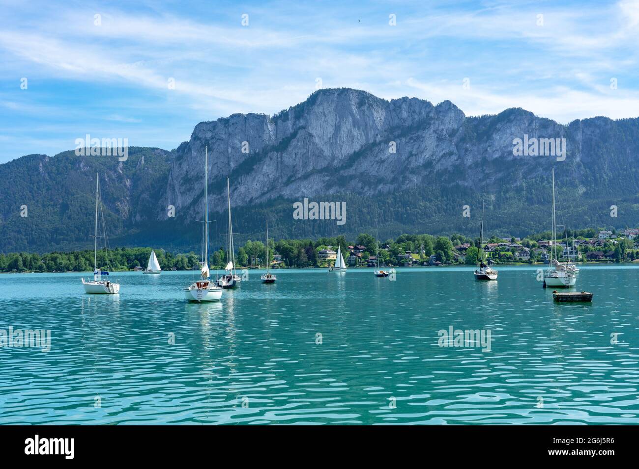 Mondsee with mountains and sailing boats on the water summertime Stock Photo