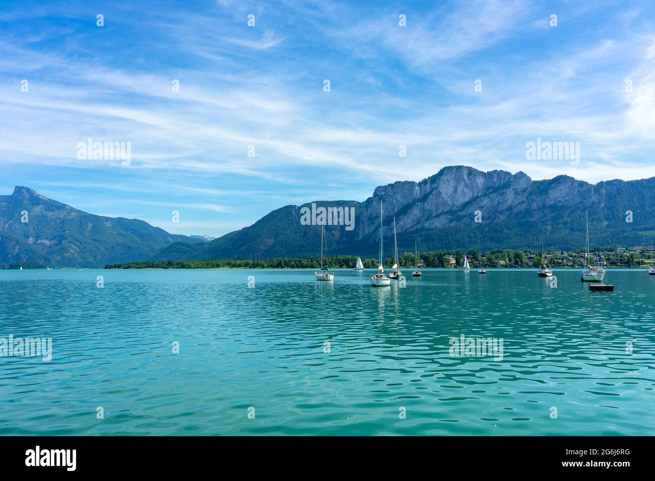 Mondsee with mountains and sailing boats on the water summertime Stock Photo