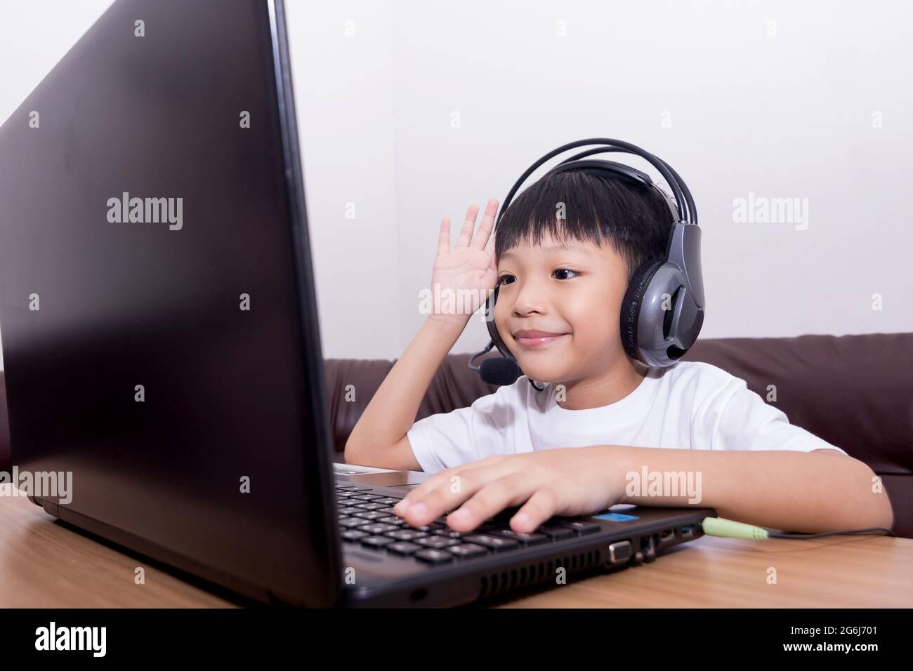Asian boy student online learning class study online video call teacher ...