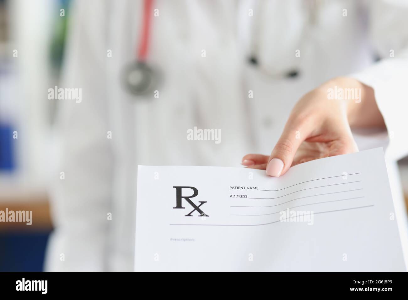 Doctor holding empty prescription form in clinic closeup Stock Photo ...