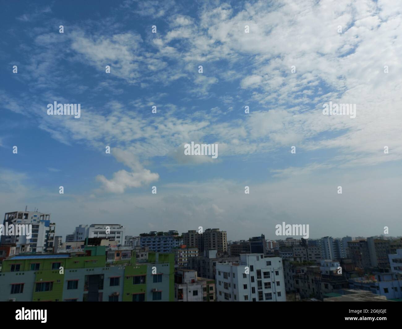 Bangladesh capital Dhaka city landscape on a sunny morning. Blue sky Dhaka city tope view. Beautiful Bangladesh city from top. Stock Photo