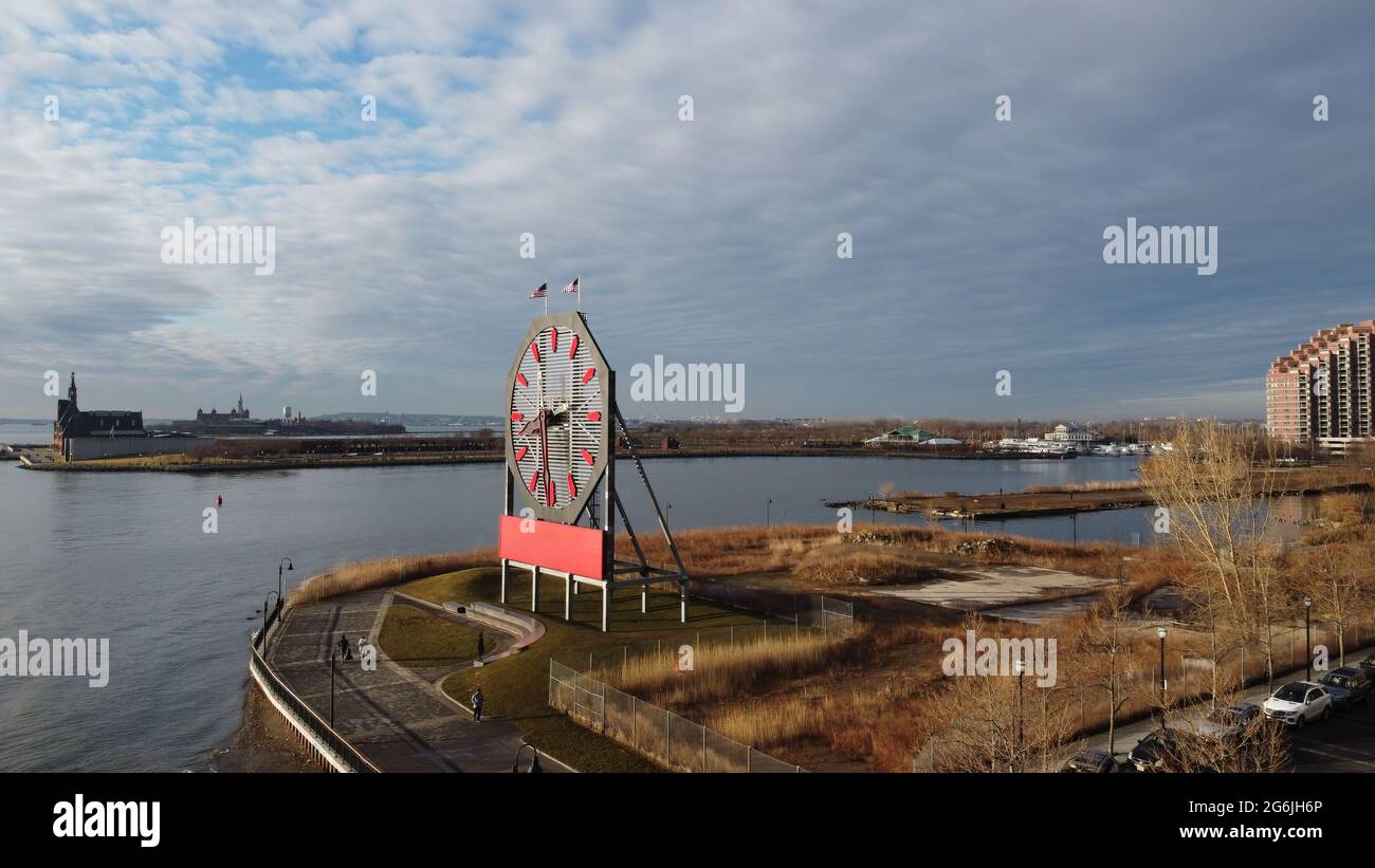 Large clock in Jersey City with the statue of liberty and ellis island