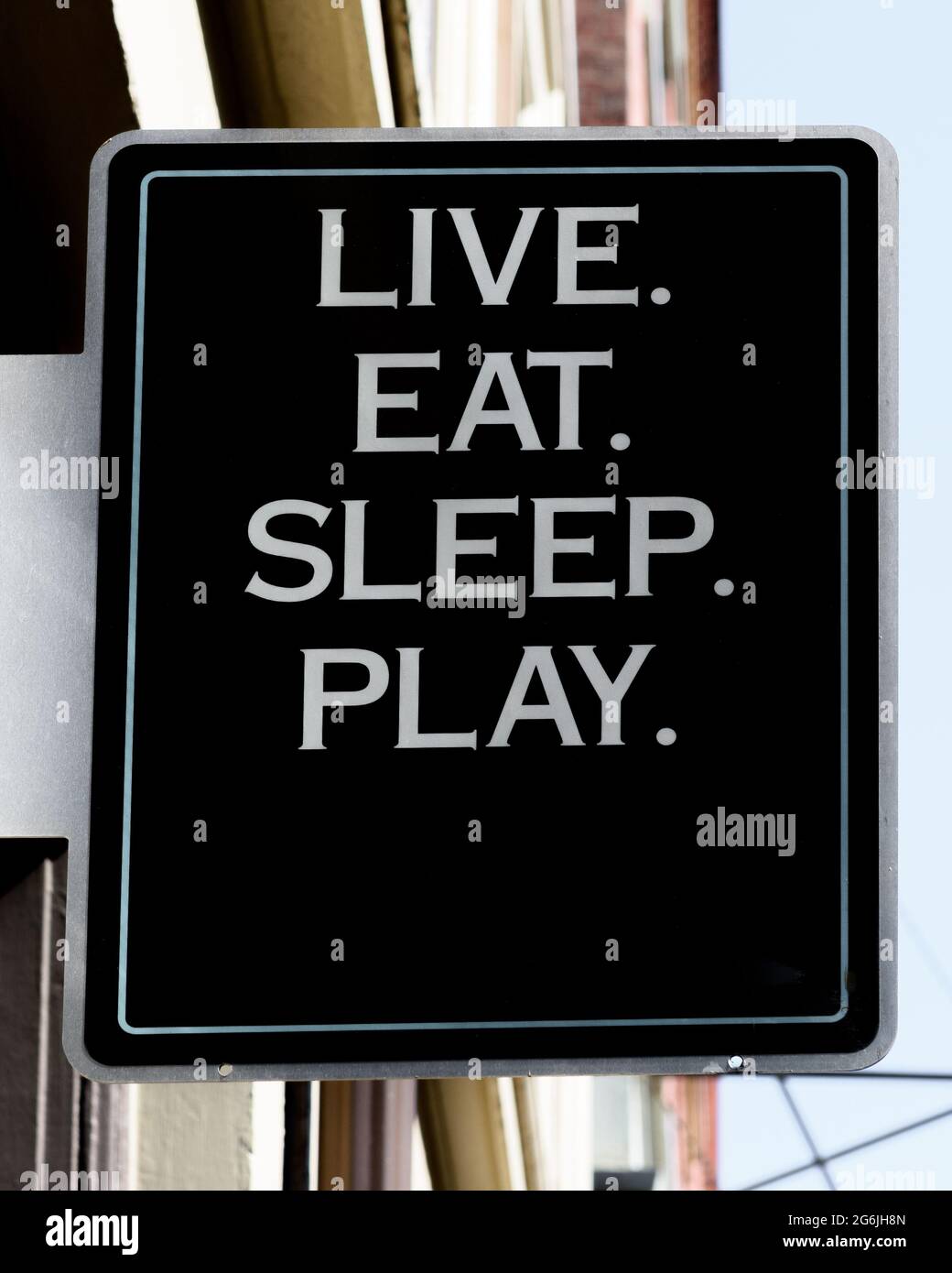 Sign that says Live, Eat, Sleep, Play Stock Photo
