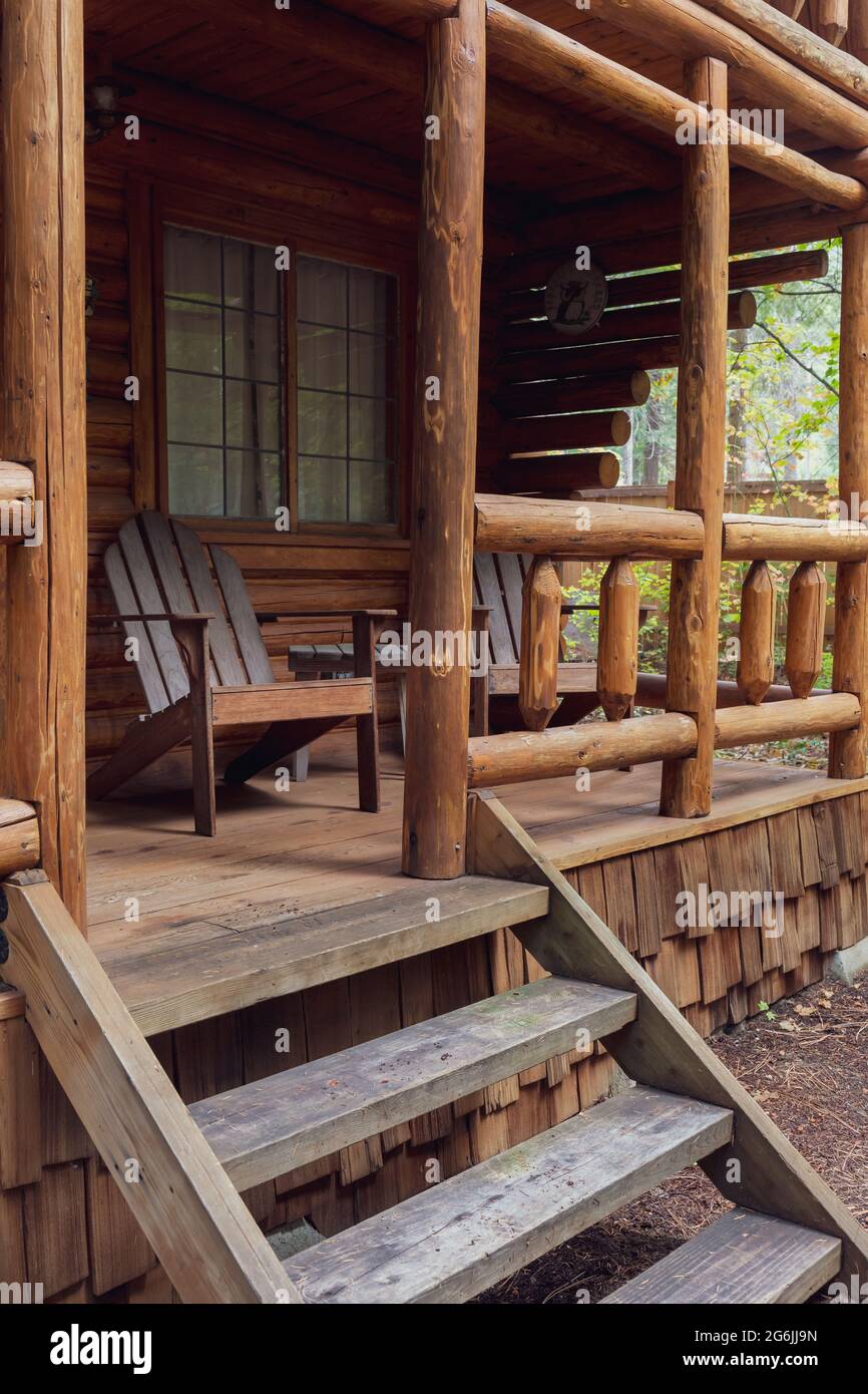 Stairs Leading to Rustic Log Cabin Front Porch Stock Photo
